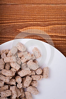 Oat bran chips close up on wooden background healthy food