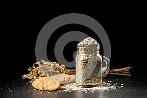 Oat bunch, cookies and flakes in flavouring jar