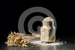 Oat bunch and flakes in flavouring jar