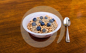 Oat Cereal with Blueberries and Spoon