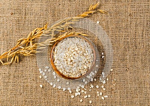 Oat cereal flakes on sackcloth