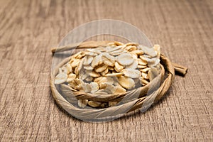 Oat cereal grain. Paper rope around grain. Selective focus.