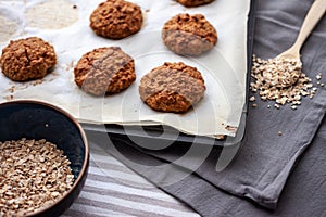 Oat cookies and in oven-tray and ingredients