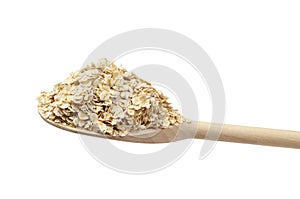 Oat flake on the wooden spoon