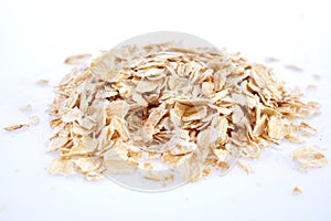 Oat flakes isolated on white. Closeup view photo