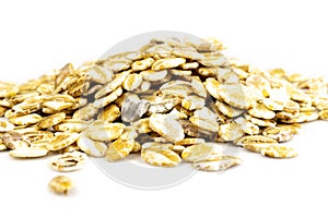 Oat flakes, pile of oatmeal isolated on white background. Healthy food concept.