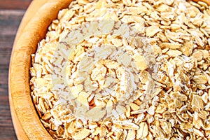 oat flakes on wooden table.healthy food concept.