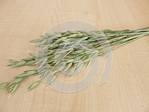 Oat florets on wooden board