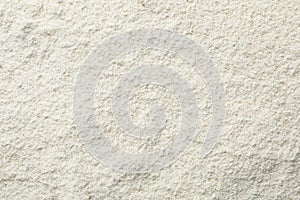 Oat flour as background, top view.