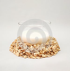 Oat milk alternative and organic raw rolled oats on white background,