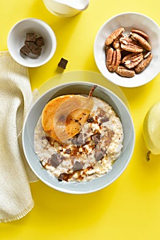 Oat porridge with caramelized pear and chocolate pieces