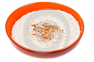 Oat porridge with cinnamon in orange bow