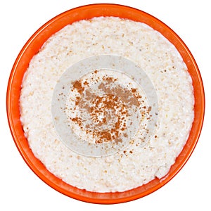 Oat porridge with cinnamon in orange bow