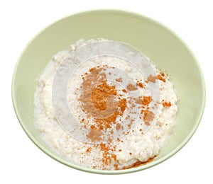 Oat porridge with cinnamon in yellow bow