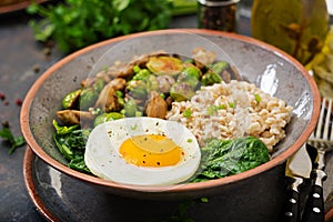 Oat porridge, egg and salad of baked vegetables - mushrooms and Brussels sprouts.