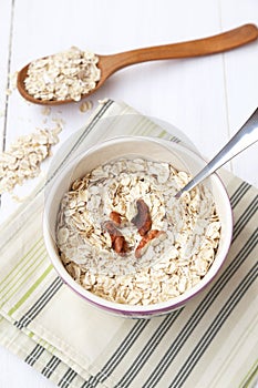 Oatflakes in bowl photo