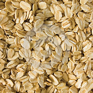 Oatmeal background rolled raw oats macro closeup