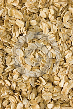 Oatmeal background texture, rolled raw oats, detailed vertical textured macro closeup pattern