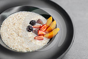 Oatmeal with berries. Delicious healthy breakfast. Vegan eating,