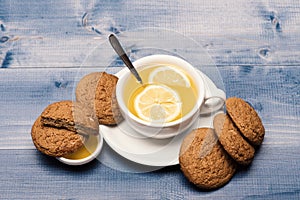 Oatmeal biscuits as pastry for cup of tea with lemon