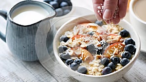 Oatmeal breakfast porridge with coconut flakes