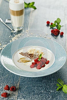 Oatmeal breakfast with raspberries