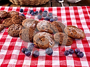 Oatmeal cookie chocolate biscuit with blueberry on picnic