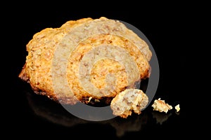 Oatmeal Cookie with Crumbs on Black Background