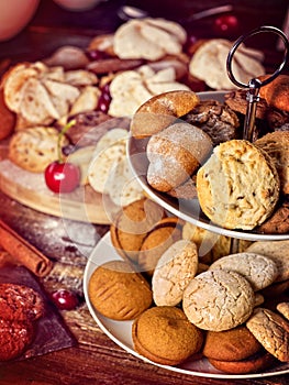 Oatmeal cookies, crispy wafer rolls on tier cake stand