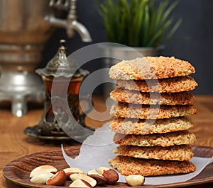Oatmeal Cookies with nuts and tea at Samovar on a wooden table