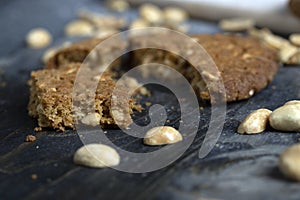 oatmeal cookies with peanuts on a black wooden table