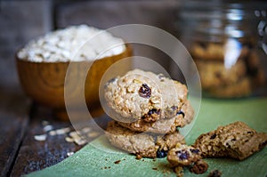 Oatmeal cookies with raisins on wooden background,vintage