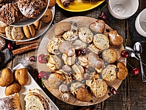 Oatmeal cookies and sand chocolate cake with cherry berry