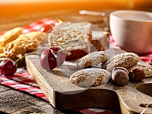 Oatmeal cookies snack and cherry breakfast close up