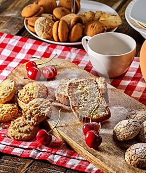 Oatmeal cookies snack and cherry breakfast close up