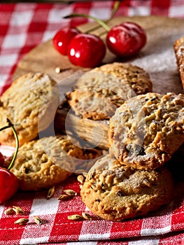 Oatmeal cookies snack and cherry breakfast close up