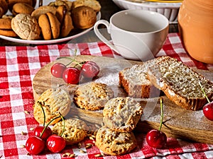 Oatmeal cookies snack and cherry breakfast close up