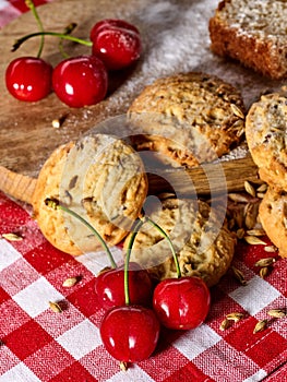 Oatmeal cookies snack and cherry breakfast close up