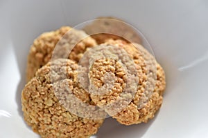 Oatmeal cookies on a white plate. Healthy food for breakfast or a snack. Close up. Soft focus