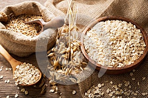 Oatmeal flakes, grains and ears of oat