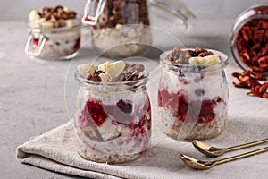 Oatmeal, granola with berries, strawberry chips, cottage cheese and natural yogurt, a delicious and healthy breakfast, located in