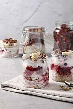 Oatmeal, granola with berries, strawberry chips, cottage cheese and natural yogurt, a delicious and healthy breakfast, located in