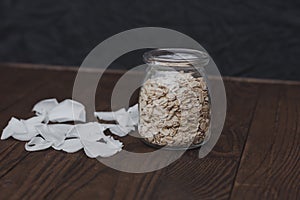 Oatmeal in a jar on a black background. Healthly food