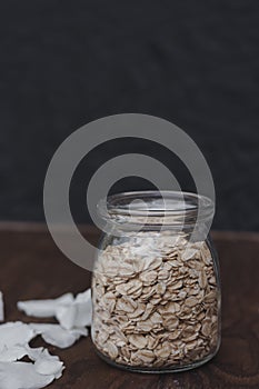 Oatmeal in a jar on a black background. Healthly food