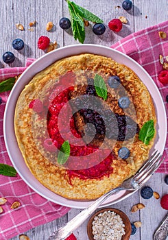 Oatmeal pancake with pureed berries