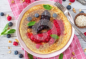 Oatmeal pancake with pureed berries