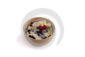 Oatmeal in a plate on a white background
