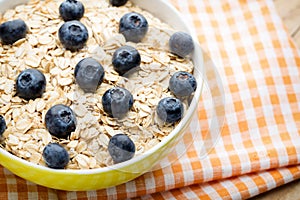 Oatmeal porridge with blueberries. Healthy breakfast.