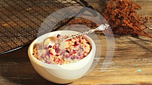 Oatmeal porridge with cherry still life on a black background breakfast, cereal,