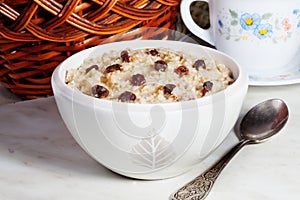 Oatmeal porridge with raisins still life kitchen